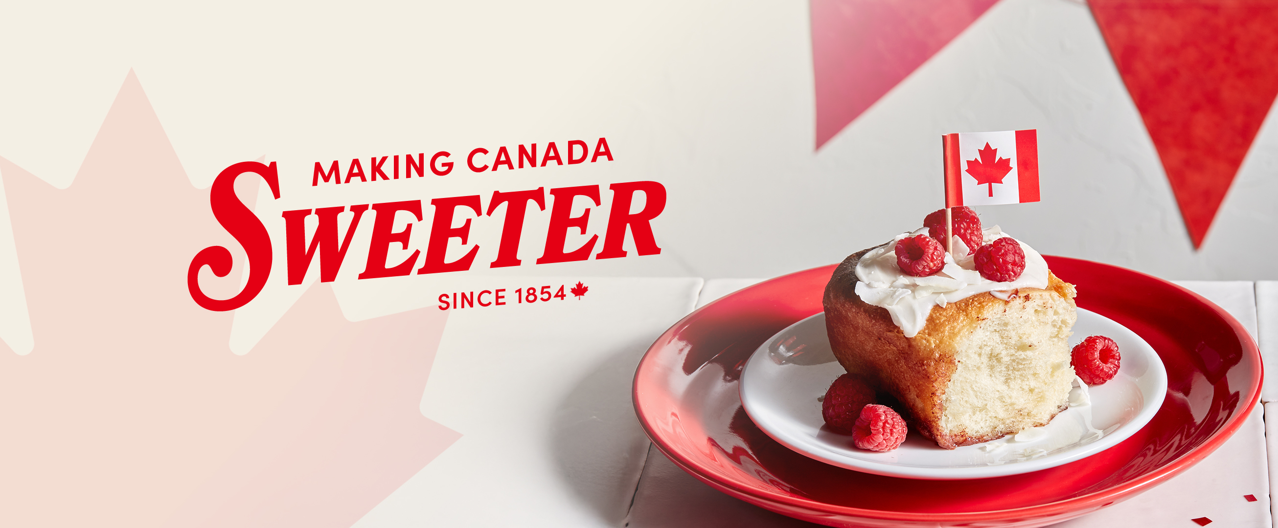 Raspberry cinnamon roll with text Making Canada Sweeter Since 1854